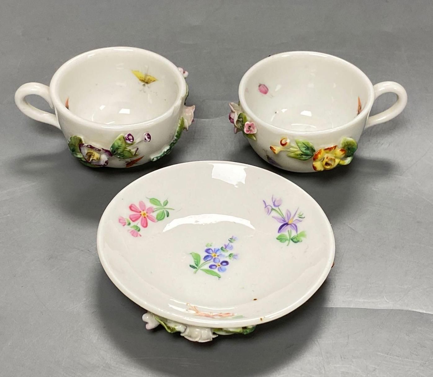 A late 19th century French porcelain flower encrusted cafe au lait set, on stand, stand 27cm